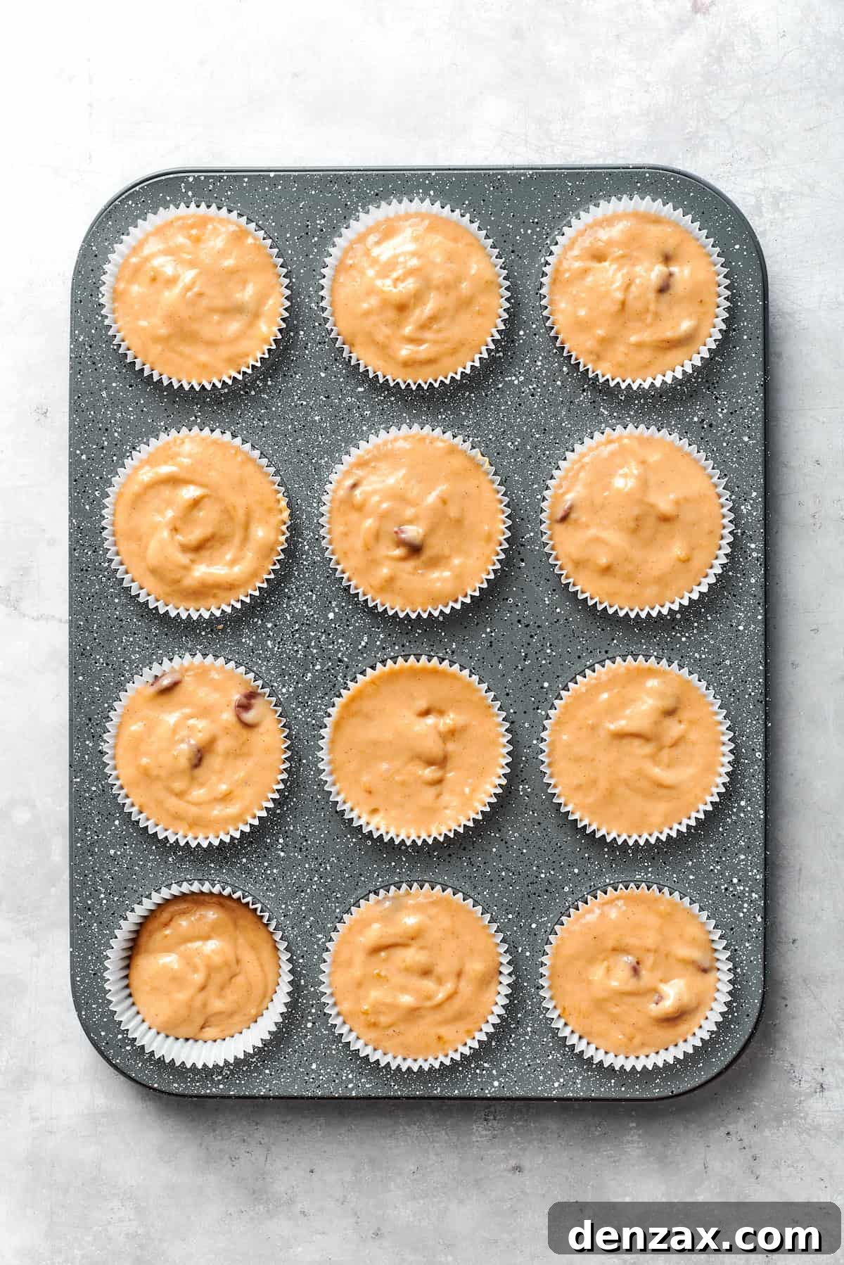 The banana muffin batter in the tin.