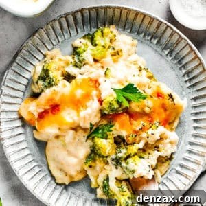 A serving of broccoli & rice casserole on a blue plate with a fork.