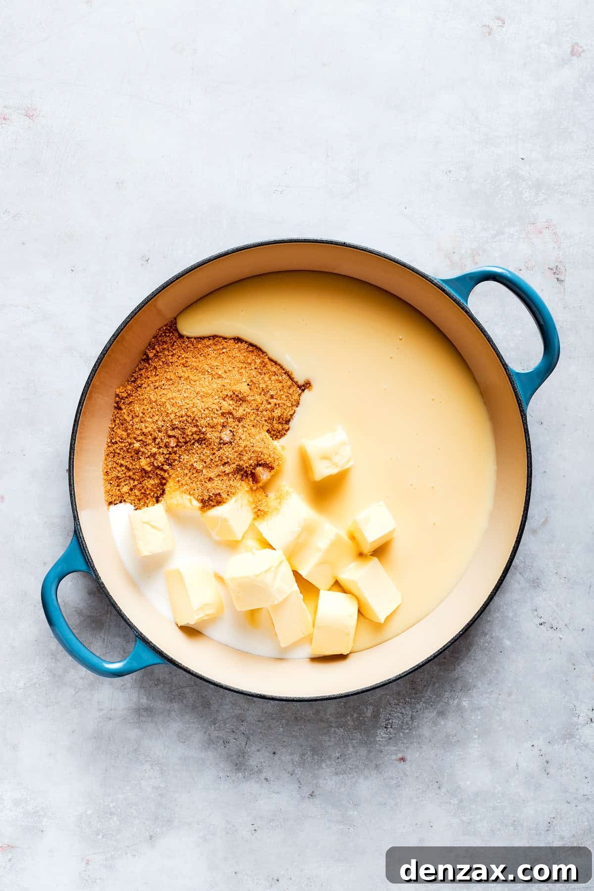 Butter, brown sugar, condensed milk, vanilla, and cream are combined in a pot.