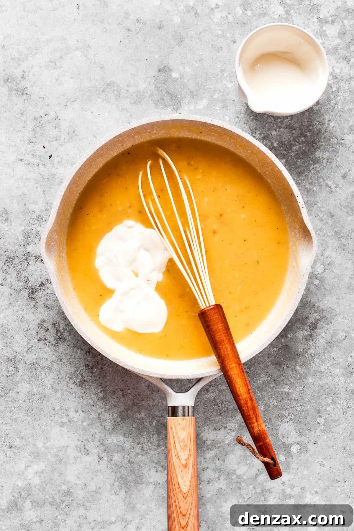Cream is whisked into gravy