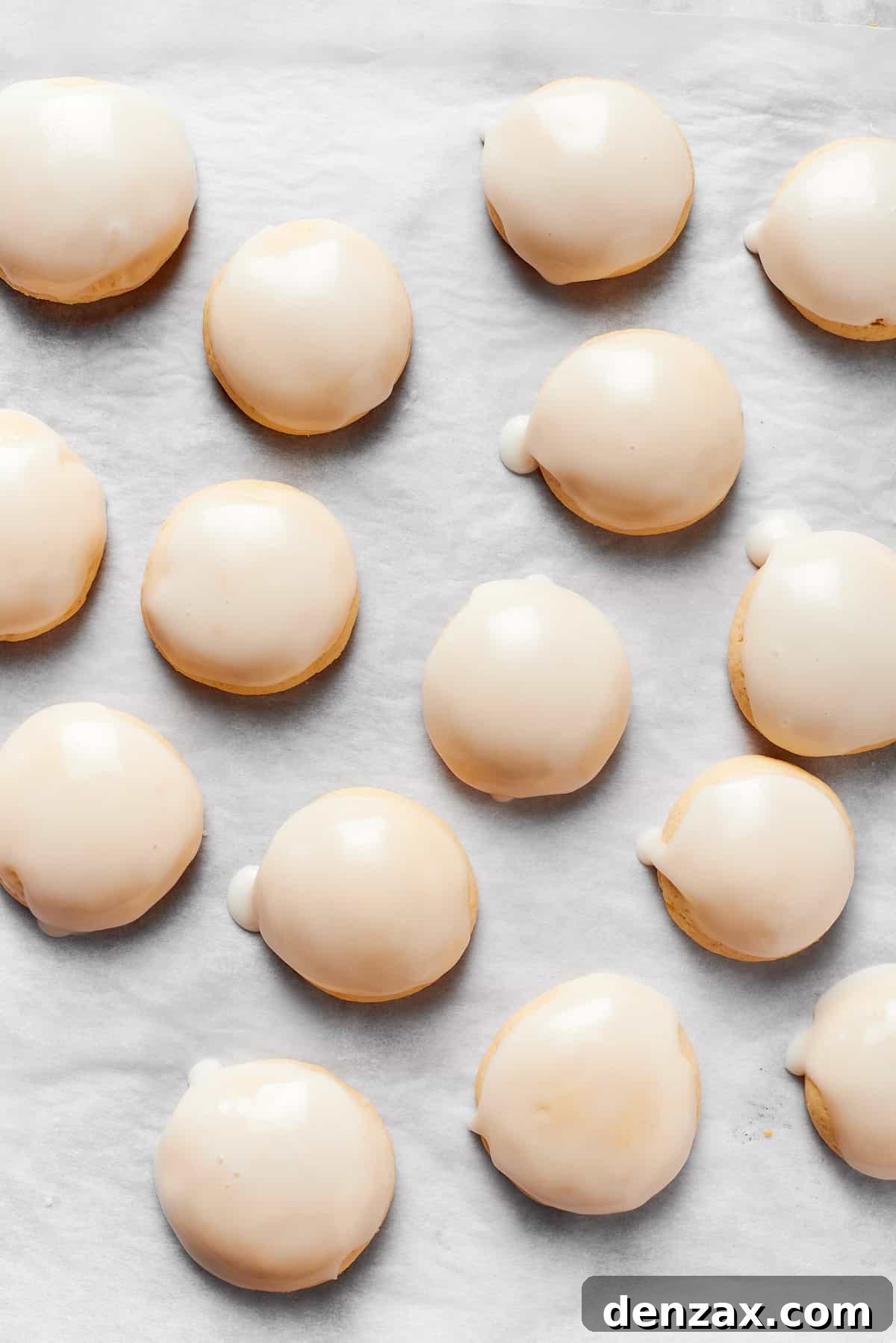 Anginetti cookies are iced with white frosting.