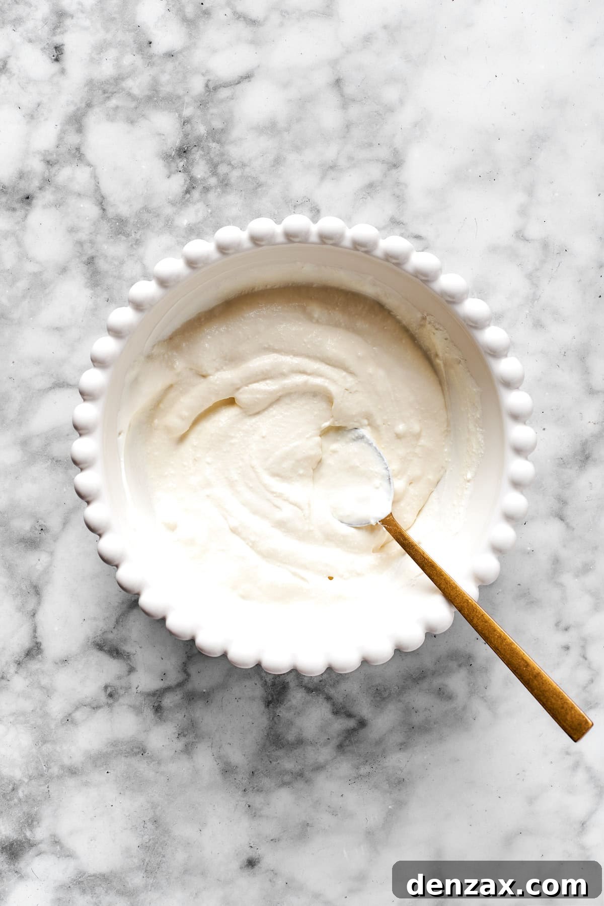 Finished cheese mixture in a white bowl.