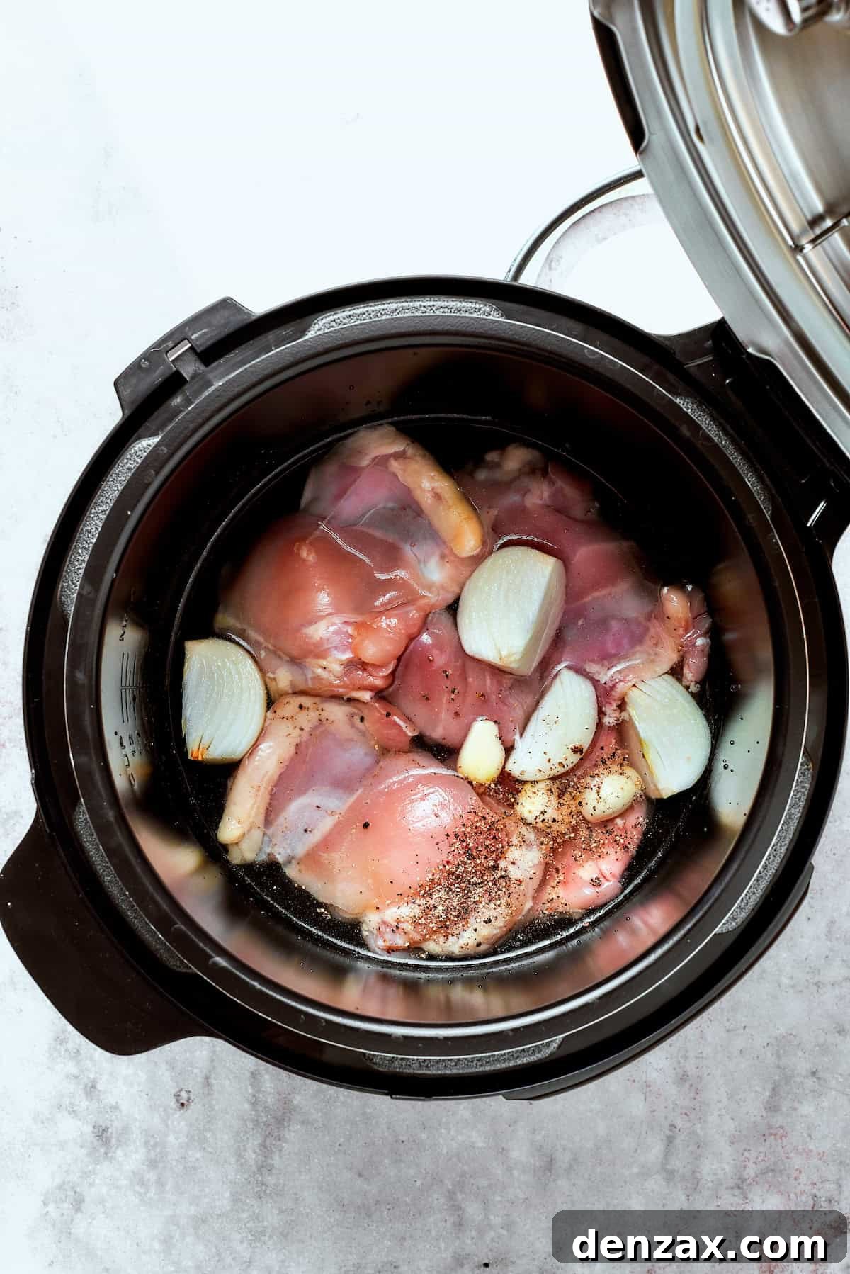 Chicken and garlic in an Instant Pot.