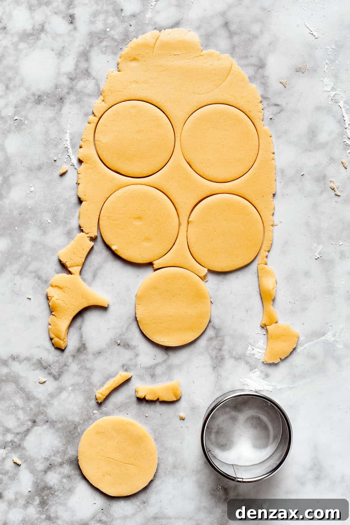 Sugar cookie dough cut into rounds.