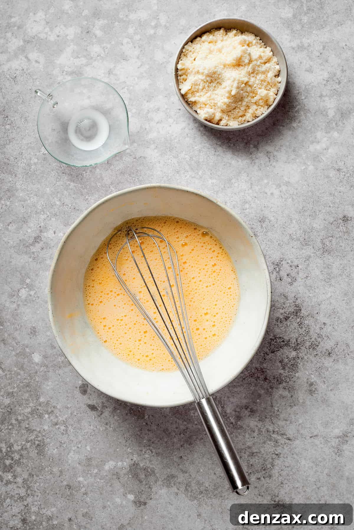 Milk and egg whisked in a bowl.