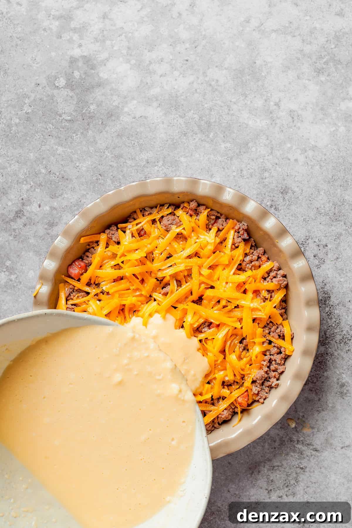 Biscuit mix poured on top of cheeseburger pie filling.