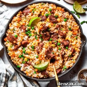 Overhead image of steak fried rice in a skillet.