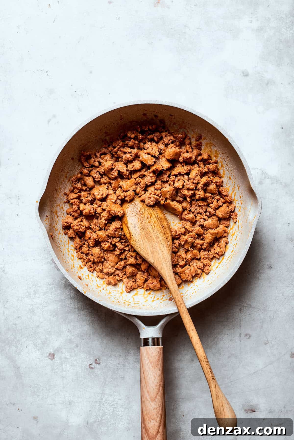 Sausage browns in a skillet.