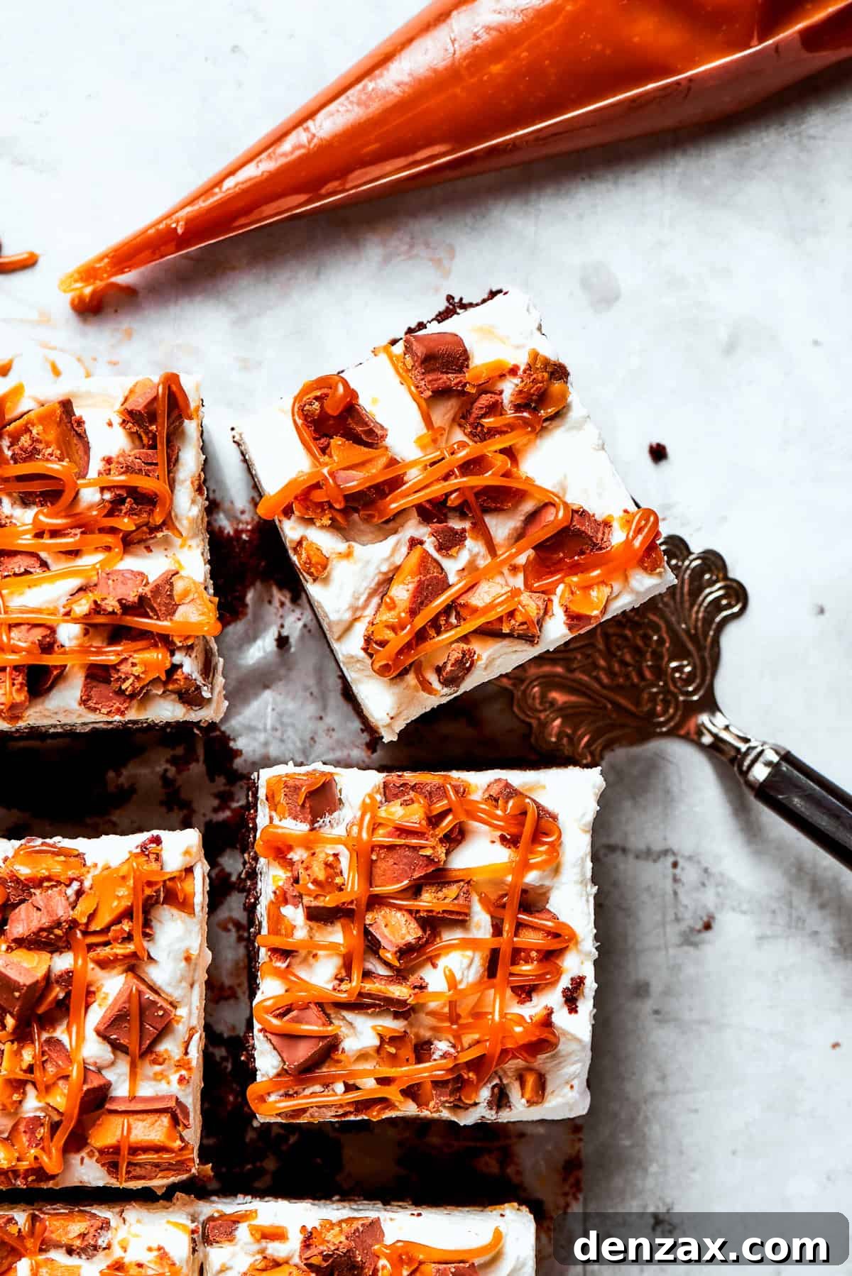 A piece of better than sex cake lifted out of the cake.