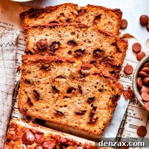 Sliced loaf of banana bread with chocolate chips.