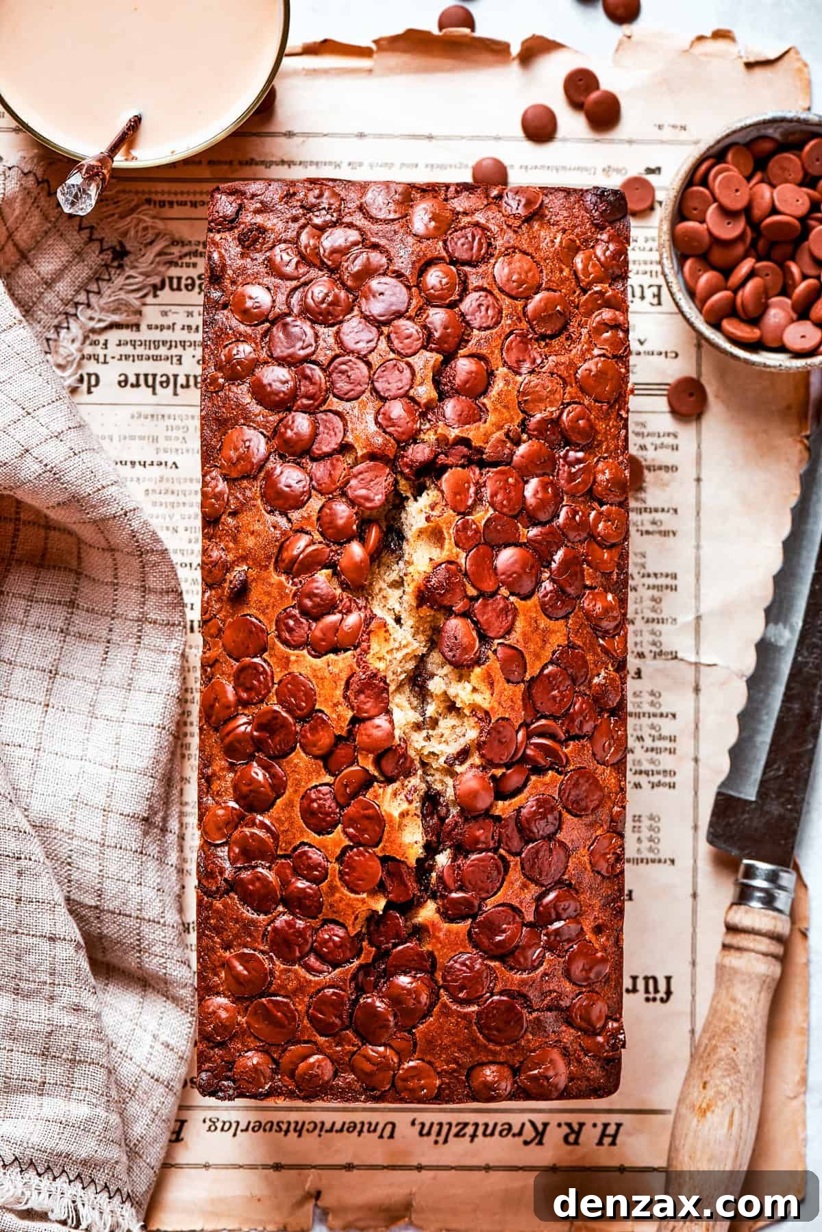 Overhead shot of chocolate chip banana bread set on a table.