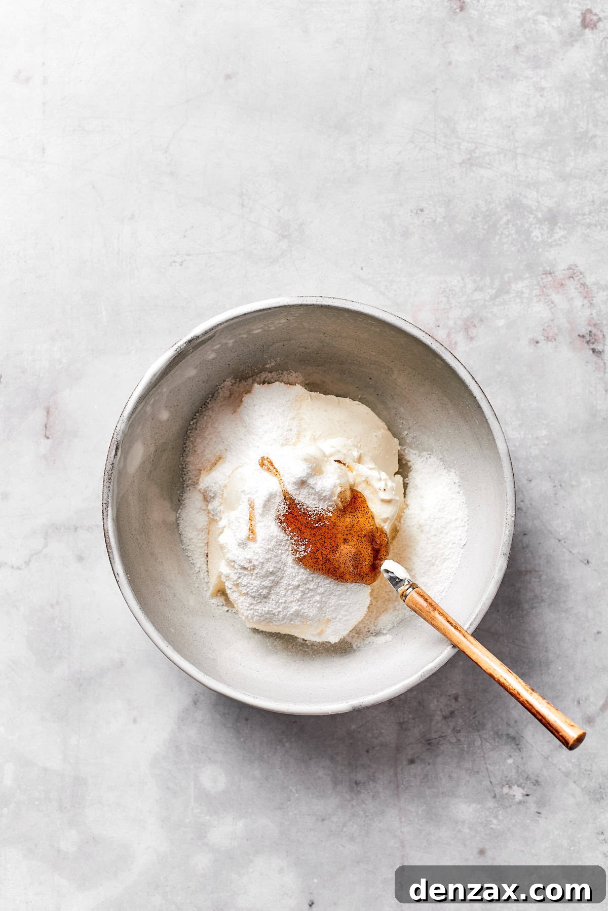 Cream cheese and butter creamed in a bowl.
