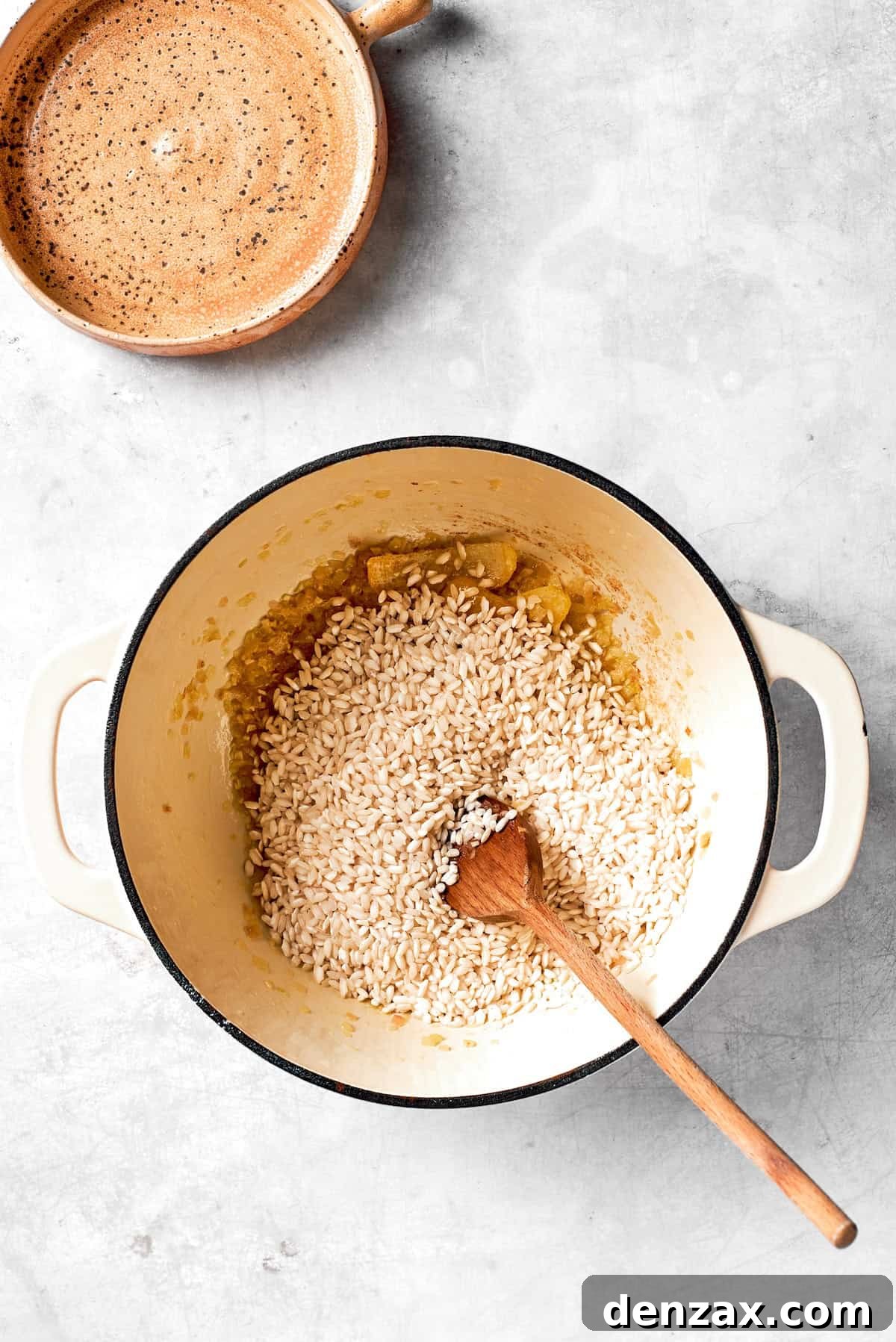 Rice is added to a pot.