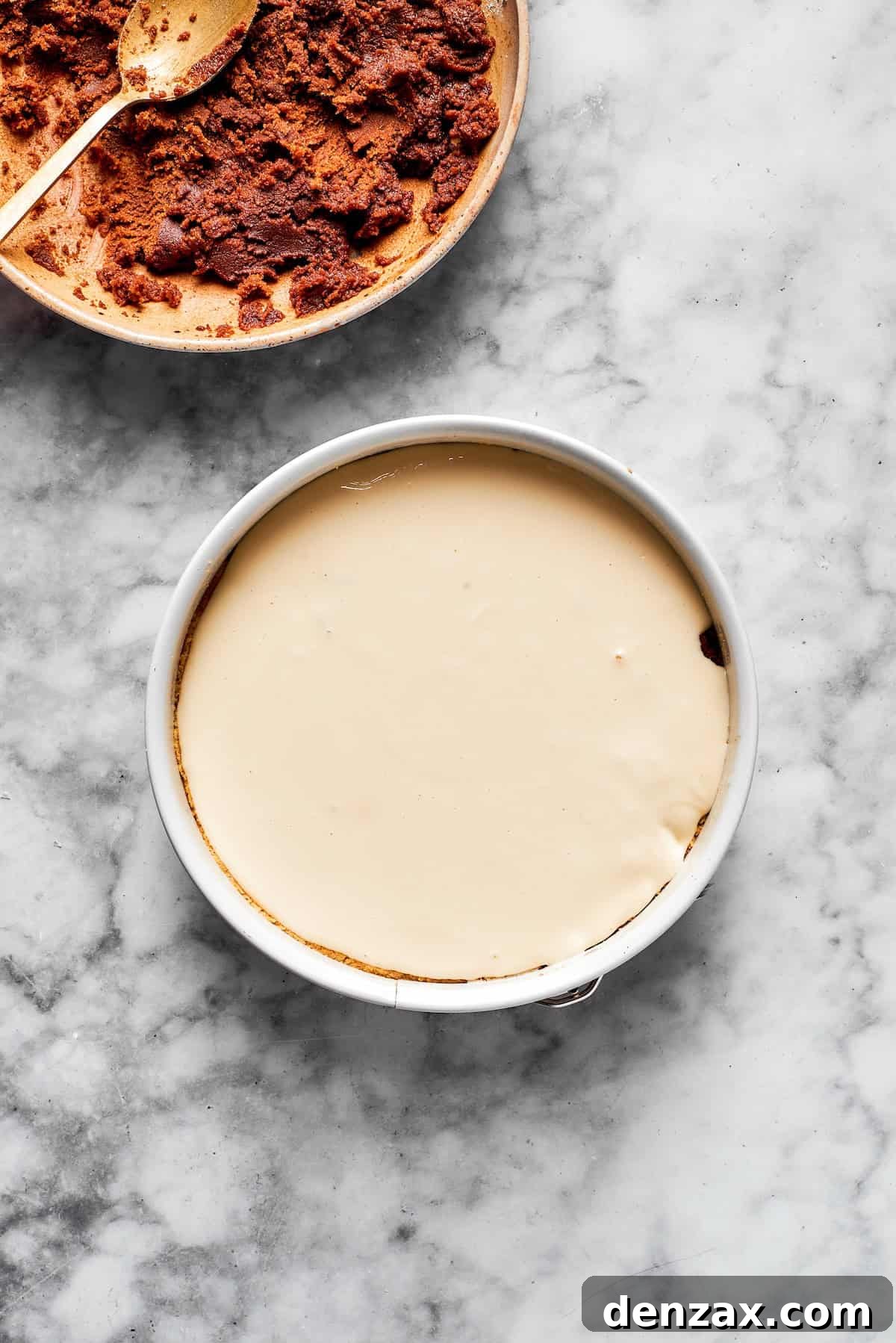 A cinnamon roll cheesecake before being baked.