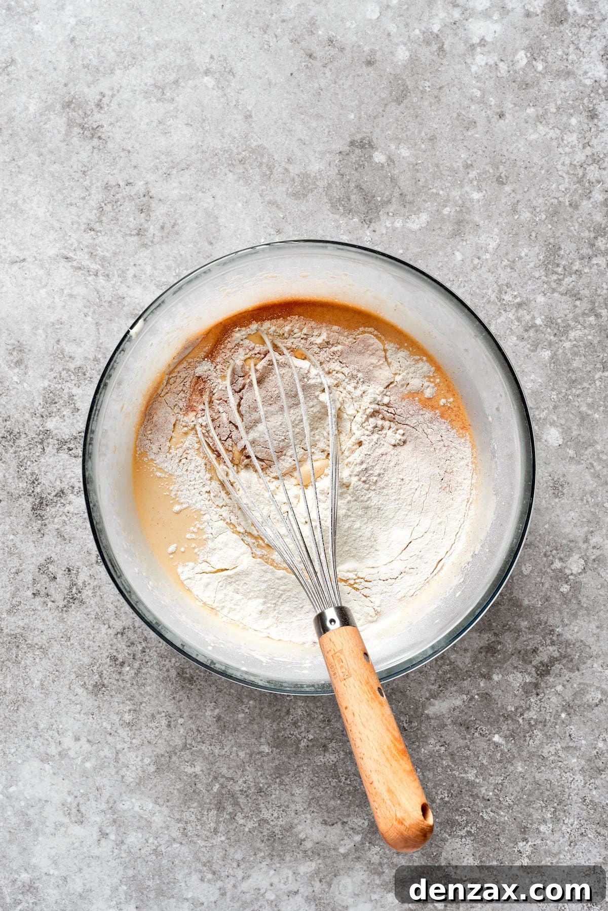 Dry mix is added to carrot cake batter.