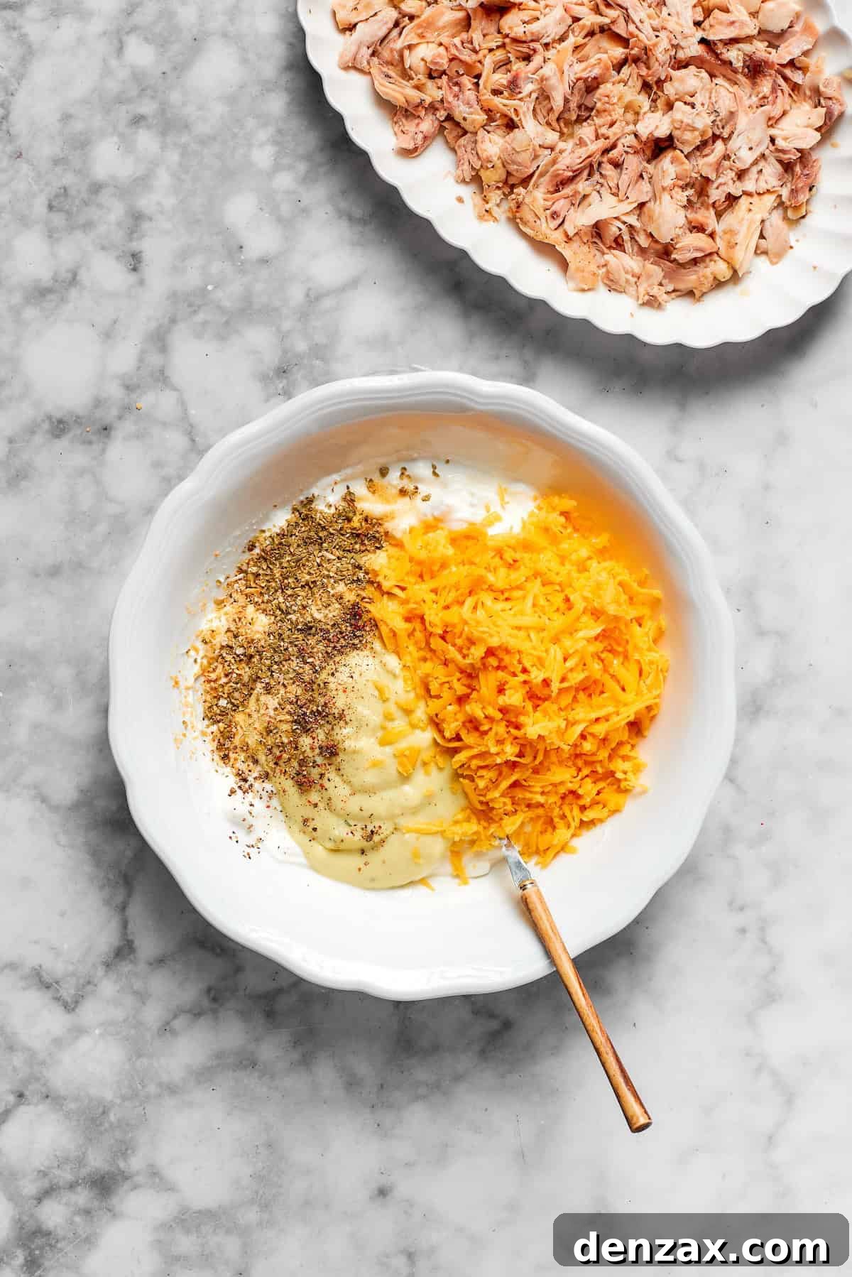 Cheese and seasonings are mixed together.
