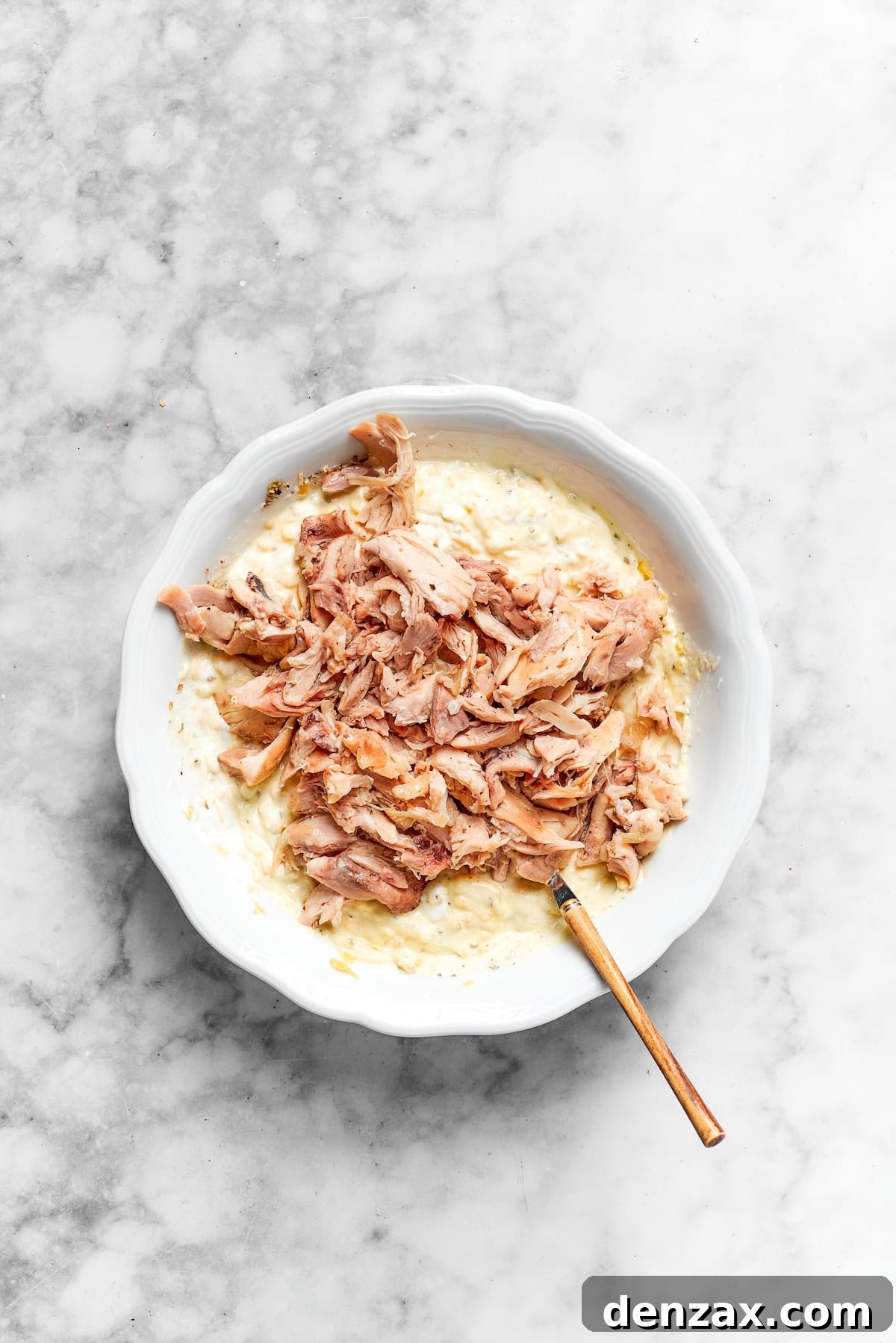 Chicken is mixed with cream.