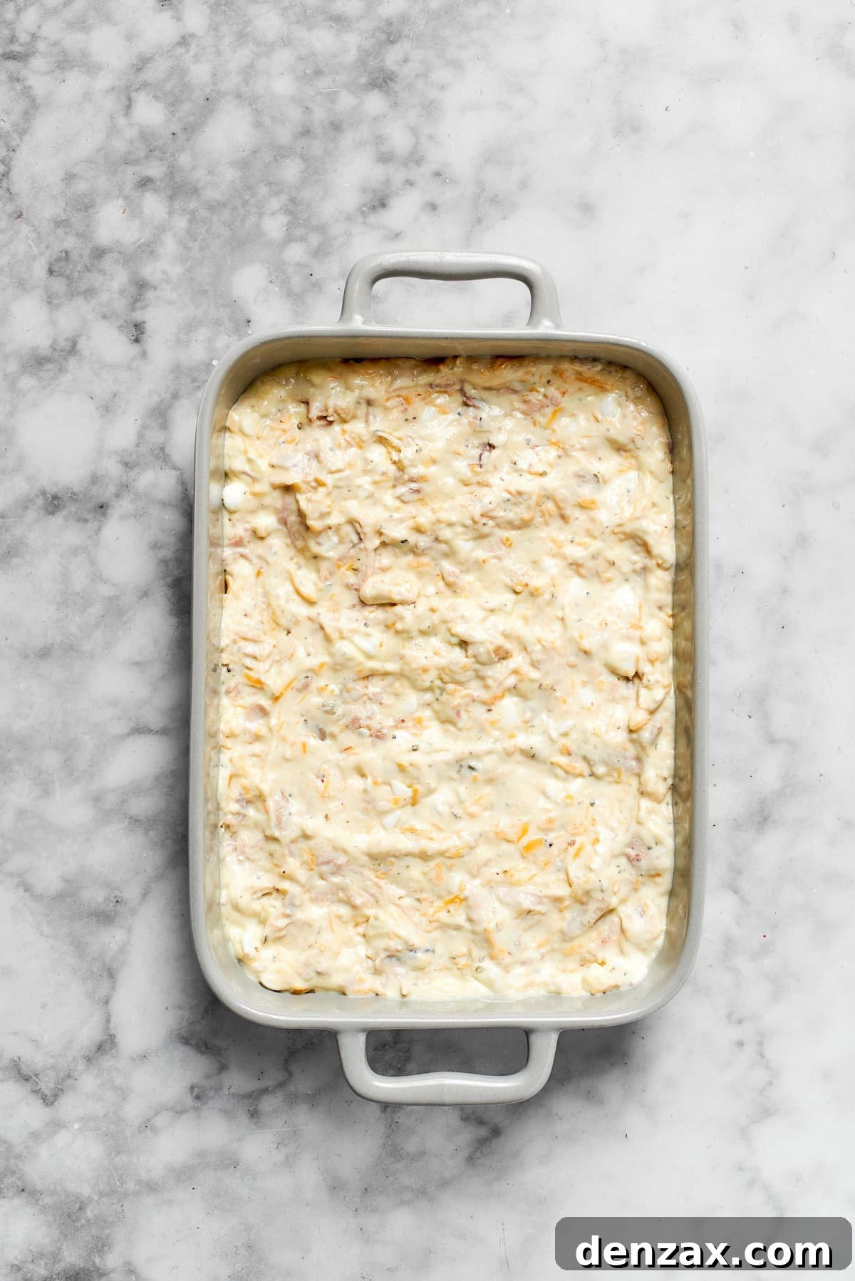 The casserole is added to a pan.
