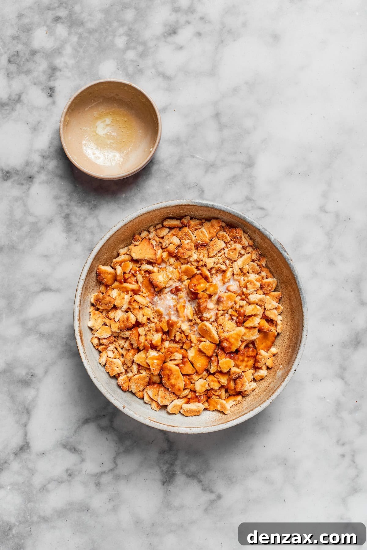 Crumbled ritz crackers in a bowl.
