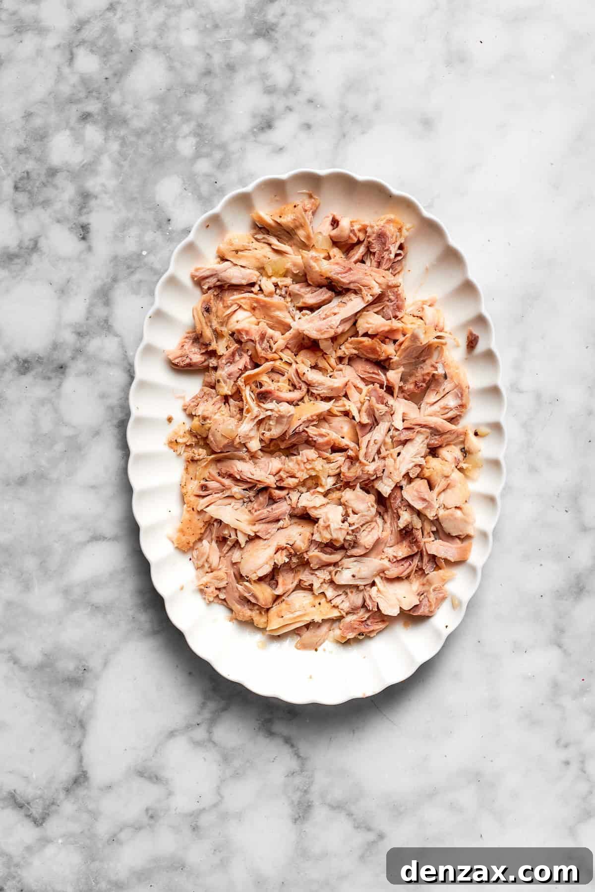 Shredded chicken on a platter.
