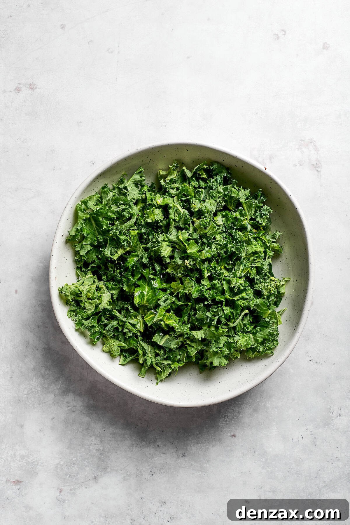 Massage the kale A bowl of kale leaves.