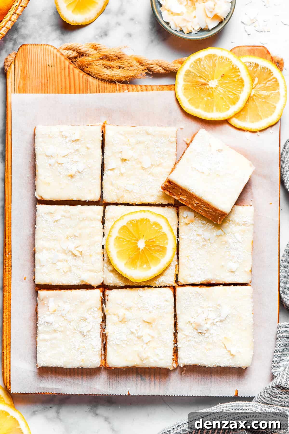 Squares of lemon slice topped with frosting.