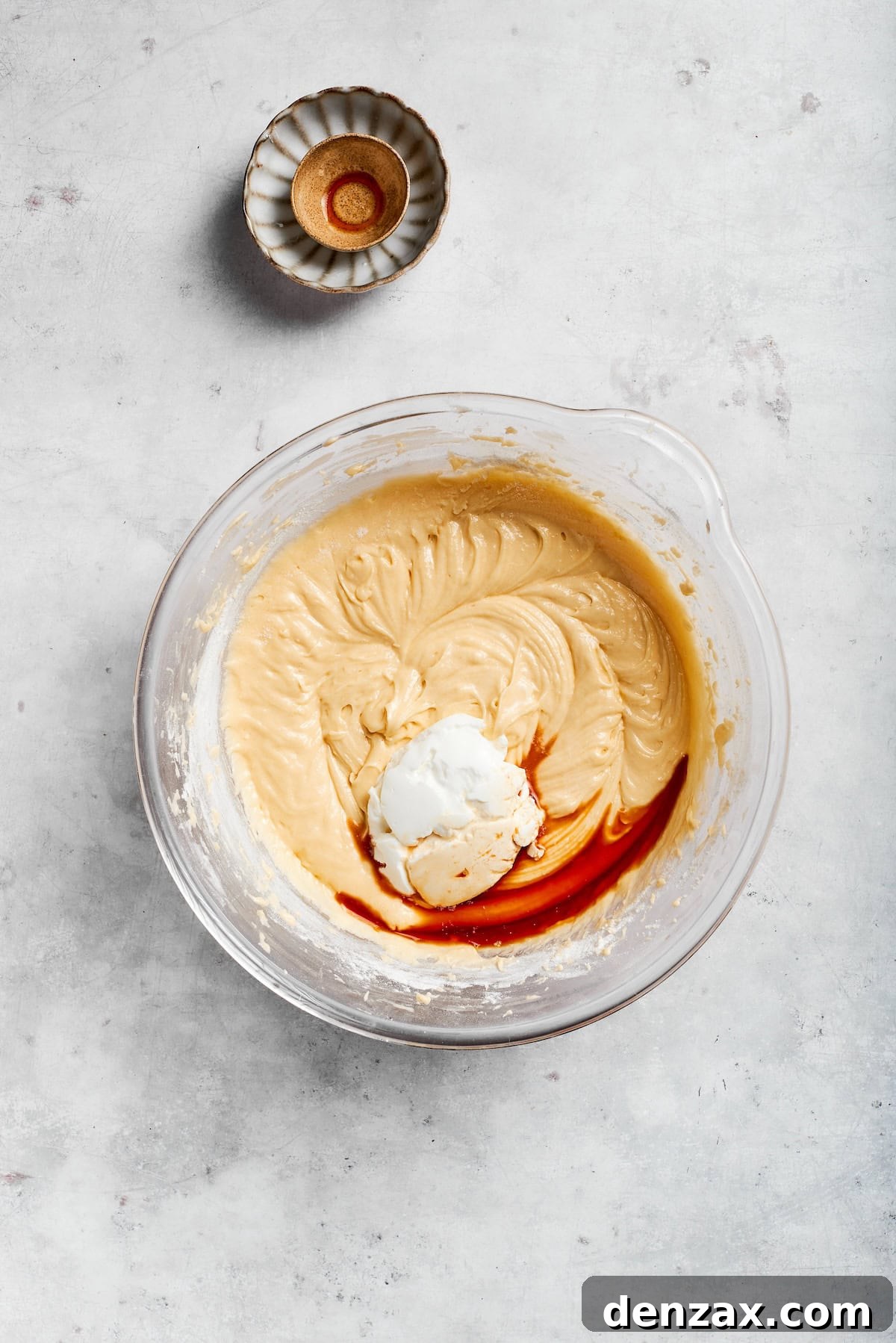 Add sour cream and vanilla. Vanilla is added to cake batter.