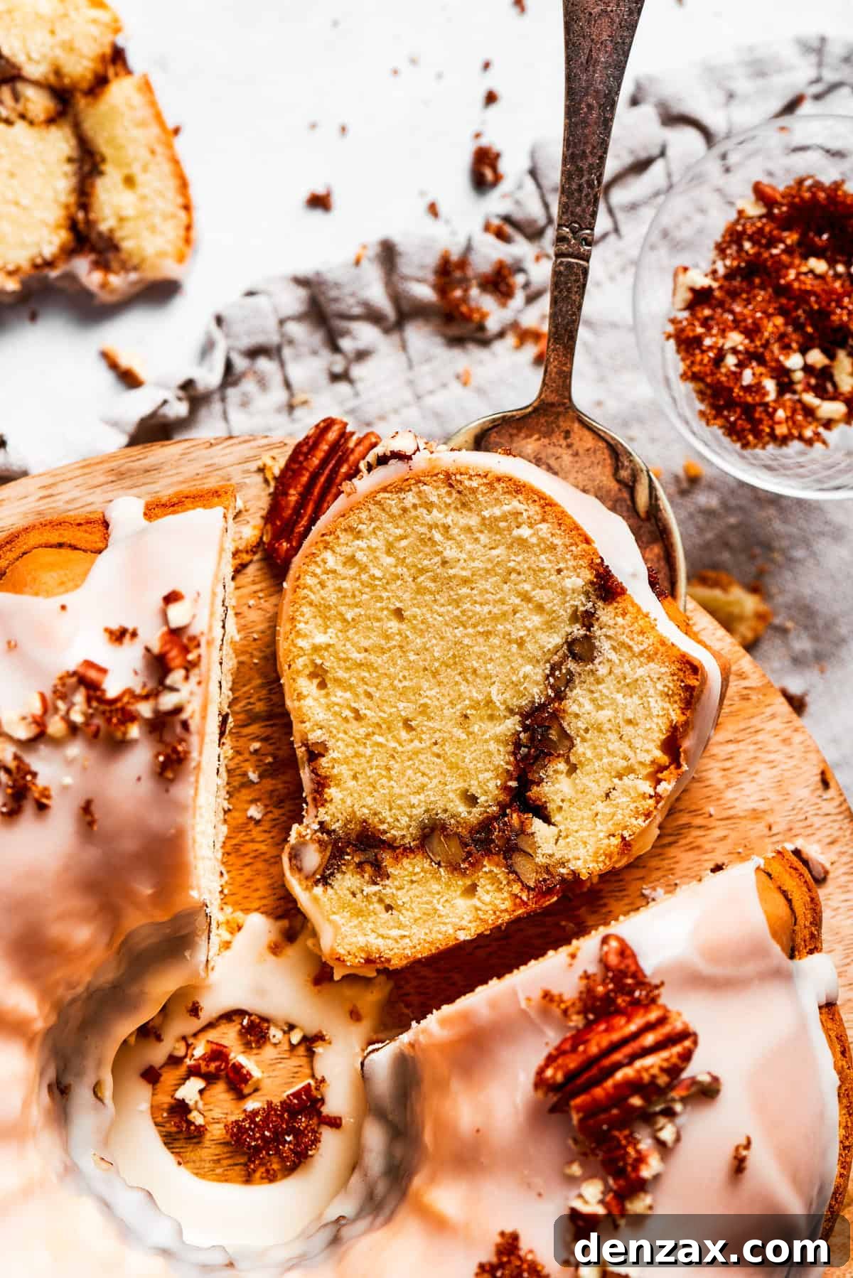 A slice of Sock It To Me Cake showing the cinnamon sugar ribbon. A slice of sock it to me cake with the cinnamon sugar ribbon across it.
