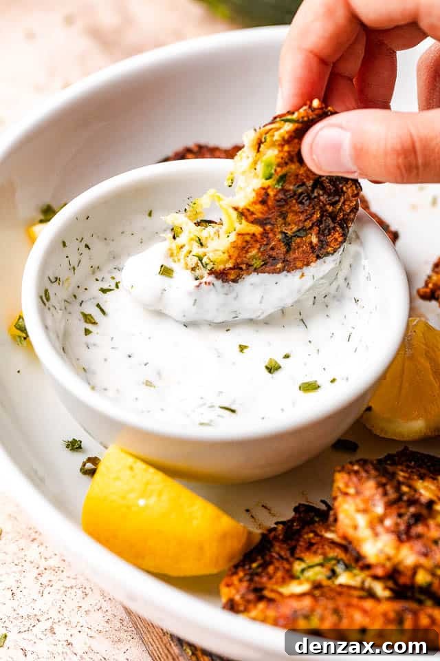 dipping zucchini cake in a yogurt dip