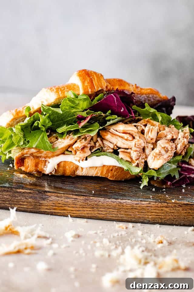 side view of shredded bbq chicken croissant sandwich