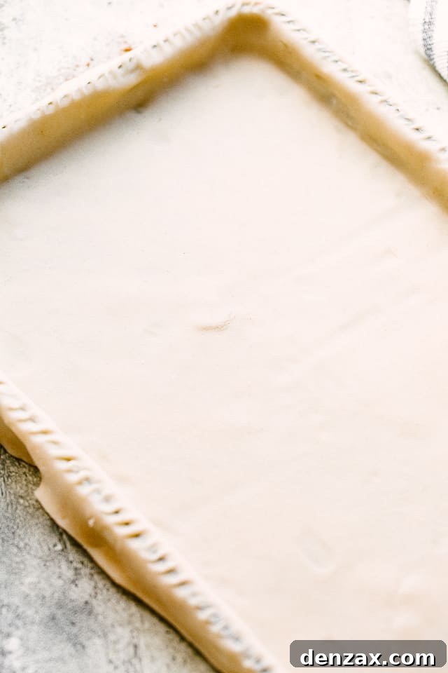 pie dough stretched over a sheet pan.