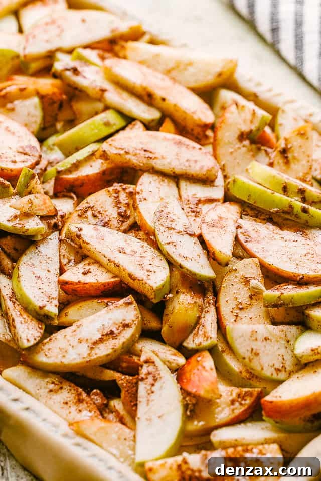 Sliced apples tossed with sugar and cinnamon.