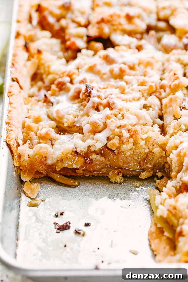 side shot of apple slab pie in a sheet pan.