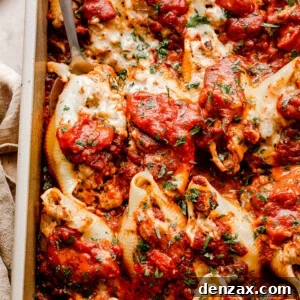 Cheesy Stuffed Pasta Shells with Spinach and Ricotta 2 close up top view of pasta shells stuffed with beef and topped with shredded cheese and marinara