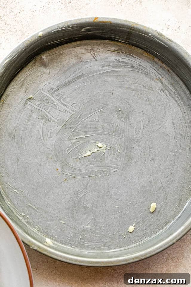 overhead shot of buttered cake pan