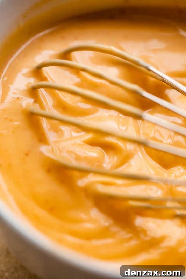 whisking mayo sriracha dipping sauce