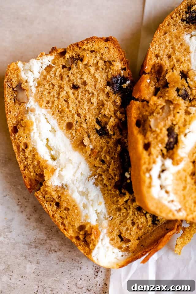 overhead shot of a slice of pumpkin bread stuffed with cream cheese