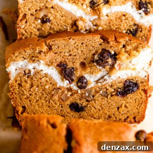 overhead shot of pumpkin bread with a swirl of cream cheese and raisins