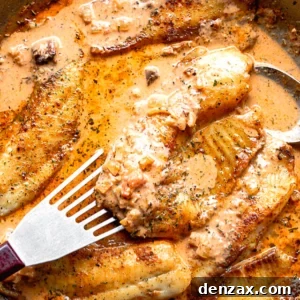 picking up tilapia fillet with a fish spatula