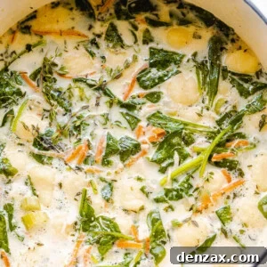 creamy gnocchi soup with spinach and chicken pictured in dutch oven