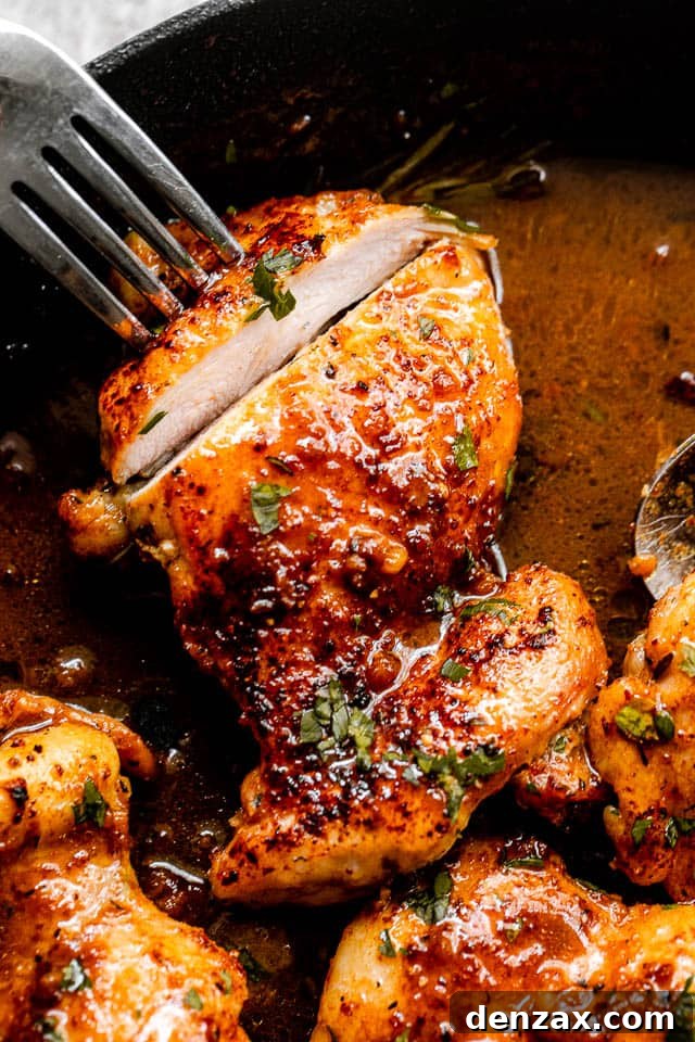 cutting into apple cider glazed chicken