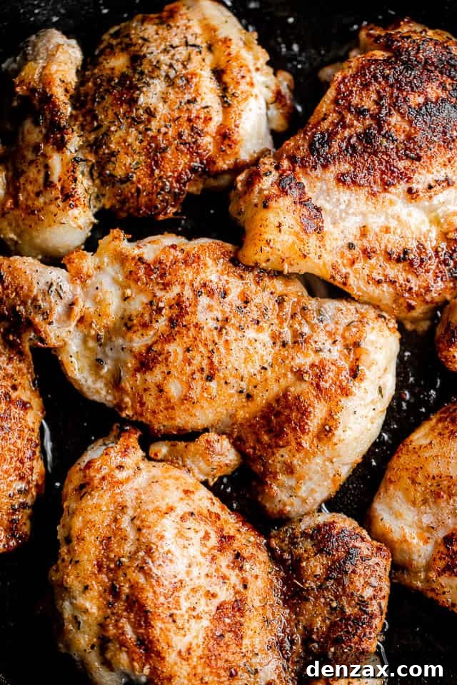 browning boneless chicken thighs in a skillet