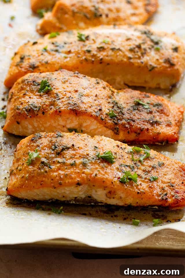 side shot of cooked salmon fillets seasoned with old bay seasoning