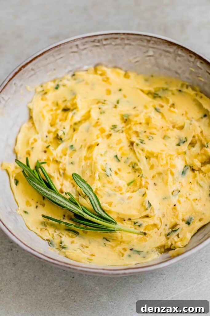 Bowl with butter and rosemary mixed together.