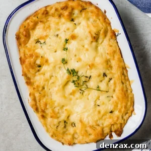 overhead shot of baked mashed potatoes in a white baking dish