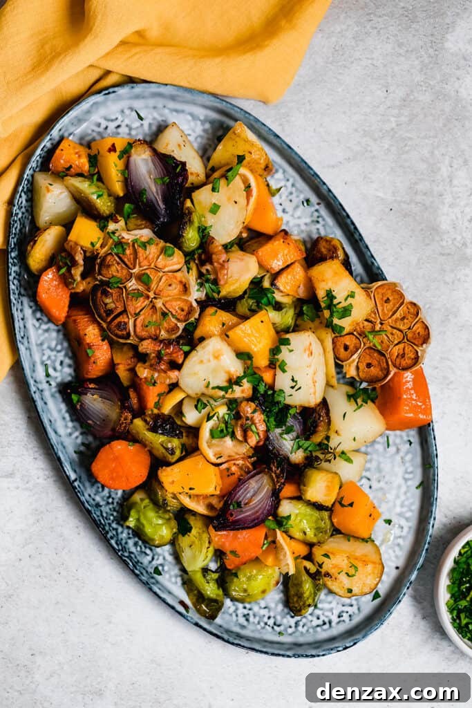Crispy Oven-Roasted Vegetables with Garlic and Herbs 2 Roasted vegetables on a blue serving platter.