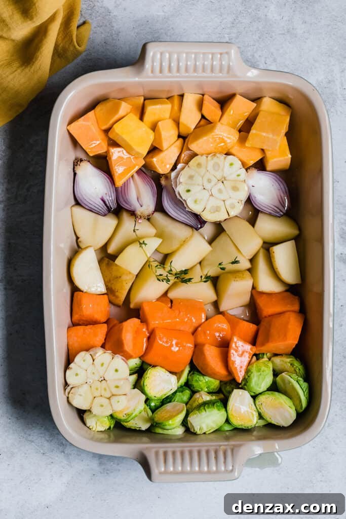 Crispy Oven-Roasted Vegetables with Garlic and Herbs 4 Chopped root vegetables in a roasting pan with oil and thyme.