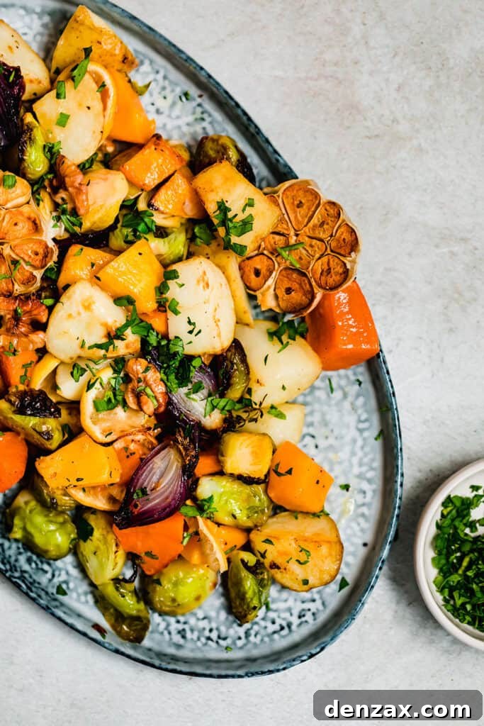 Crispy Oven-Roasted Vegetables with Garlic and Herbs 6 Golden roasted root vegetables on a blue serving platter.