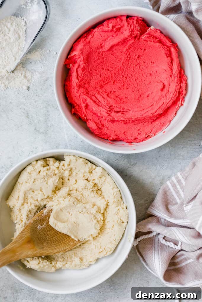 Red and White Candy Cane Cookie Dough in Two Separate White Bowls