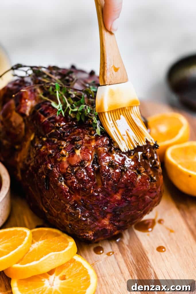 Topping the Cooked Christmas Ham with the Rest of the Glaze